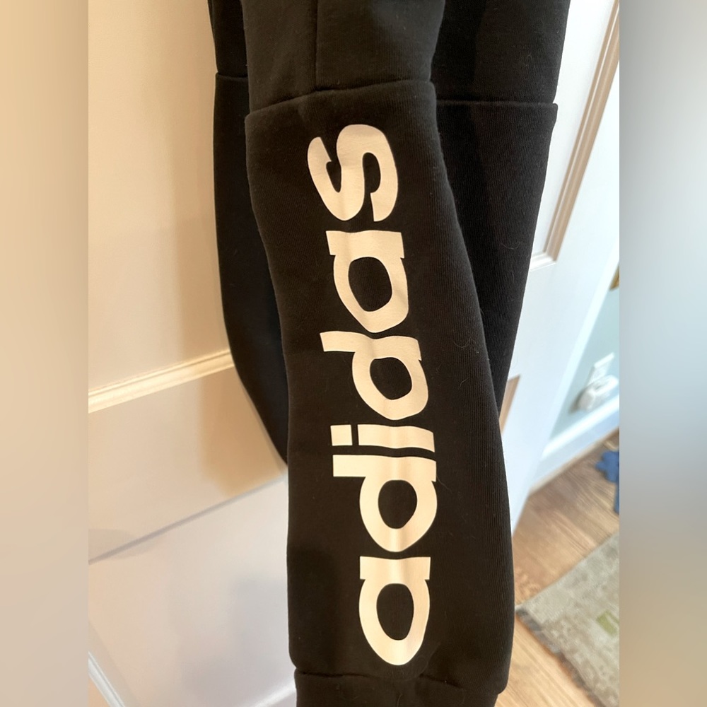 Adidas sweatpants , cropped at ankle